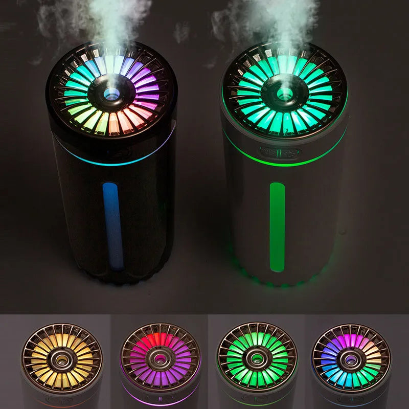 Black portable USB rechargeable humidifier with colourful lights on a car cup holder.
