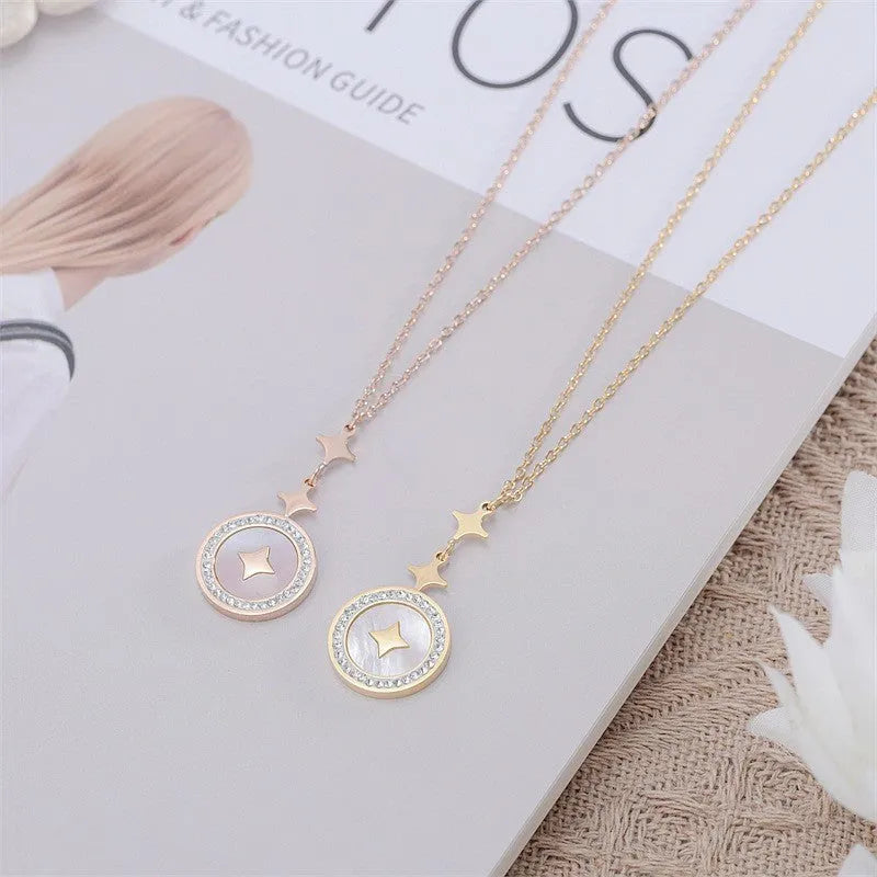 Gold titanium steel necklace with hexagonal star pendant on O-ring chain.