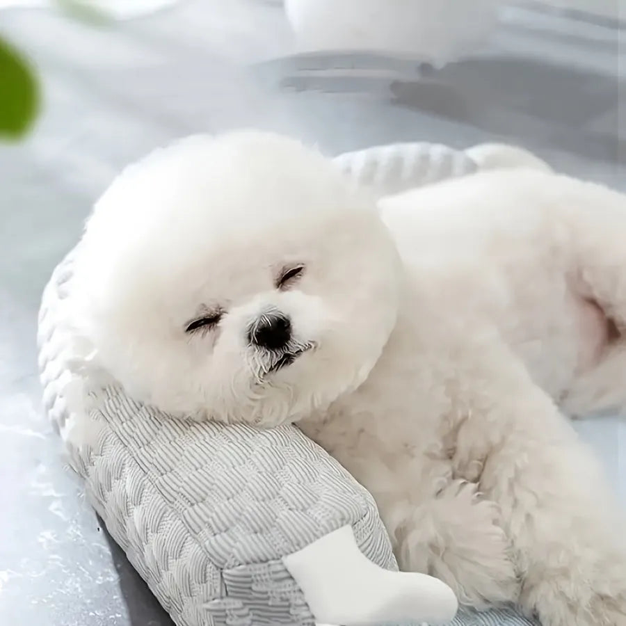 Blue monster design non-slip pet cooling bed for a dog on a hardwood floor.