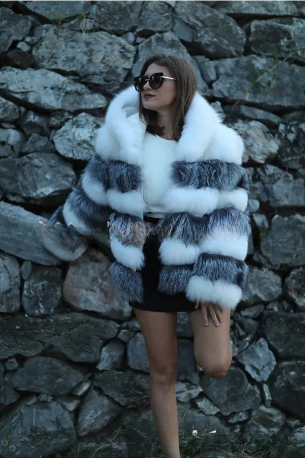Women's loose brown faux fur hooded coat on a model, street fashion style.