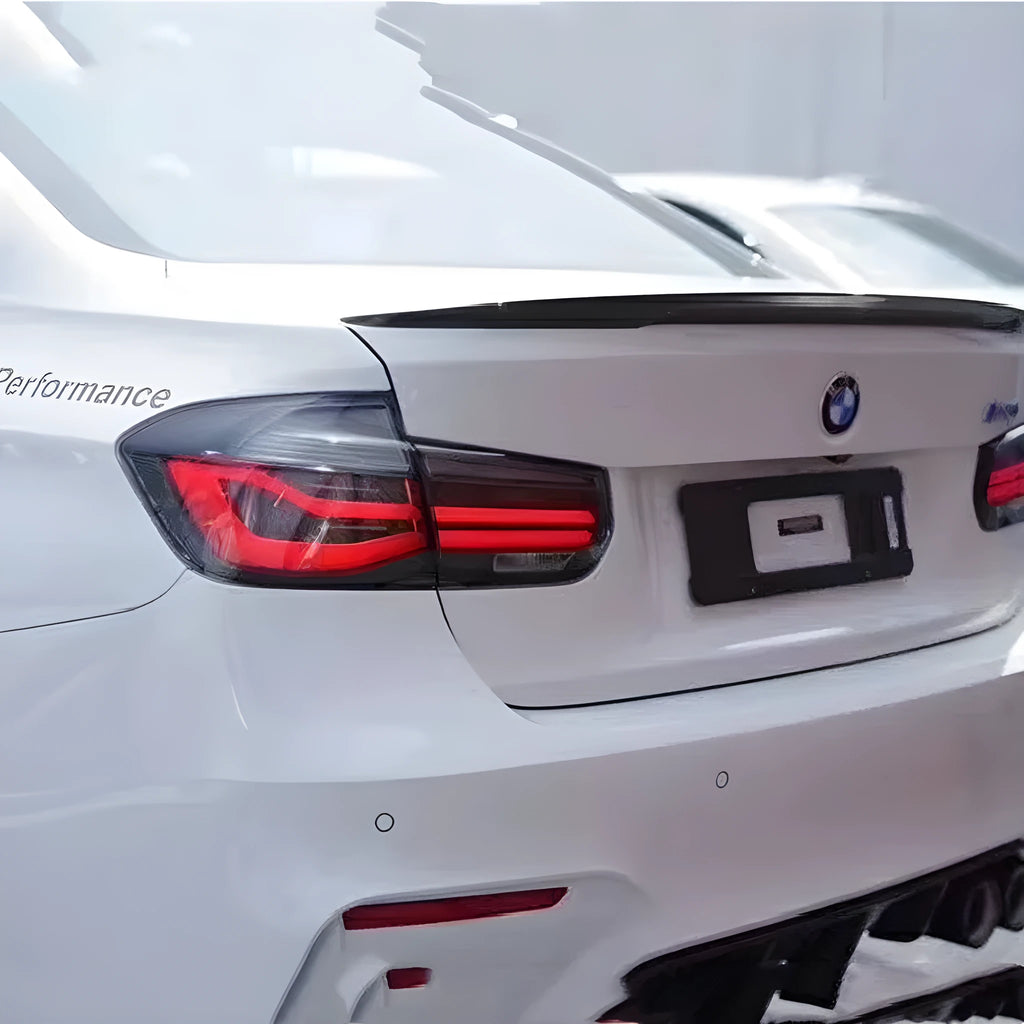 Modified streamer design LED tail light assembly for BMW 3 Series, shown in red and black smoke finishes.