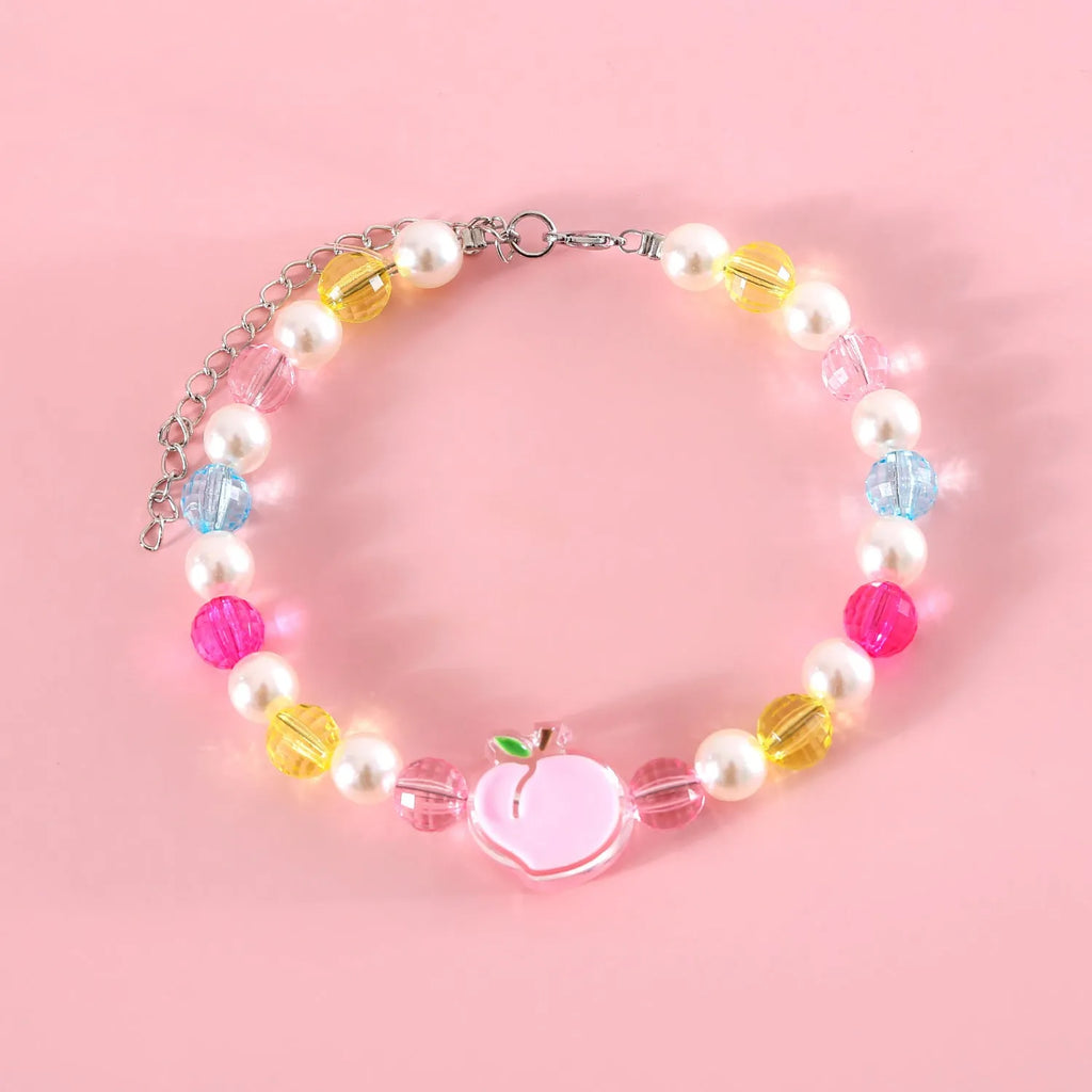 Colourful plastic bead cat necklace on a white background, showing peach, rainbow, and small flower pattern options.
