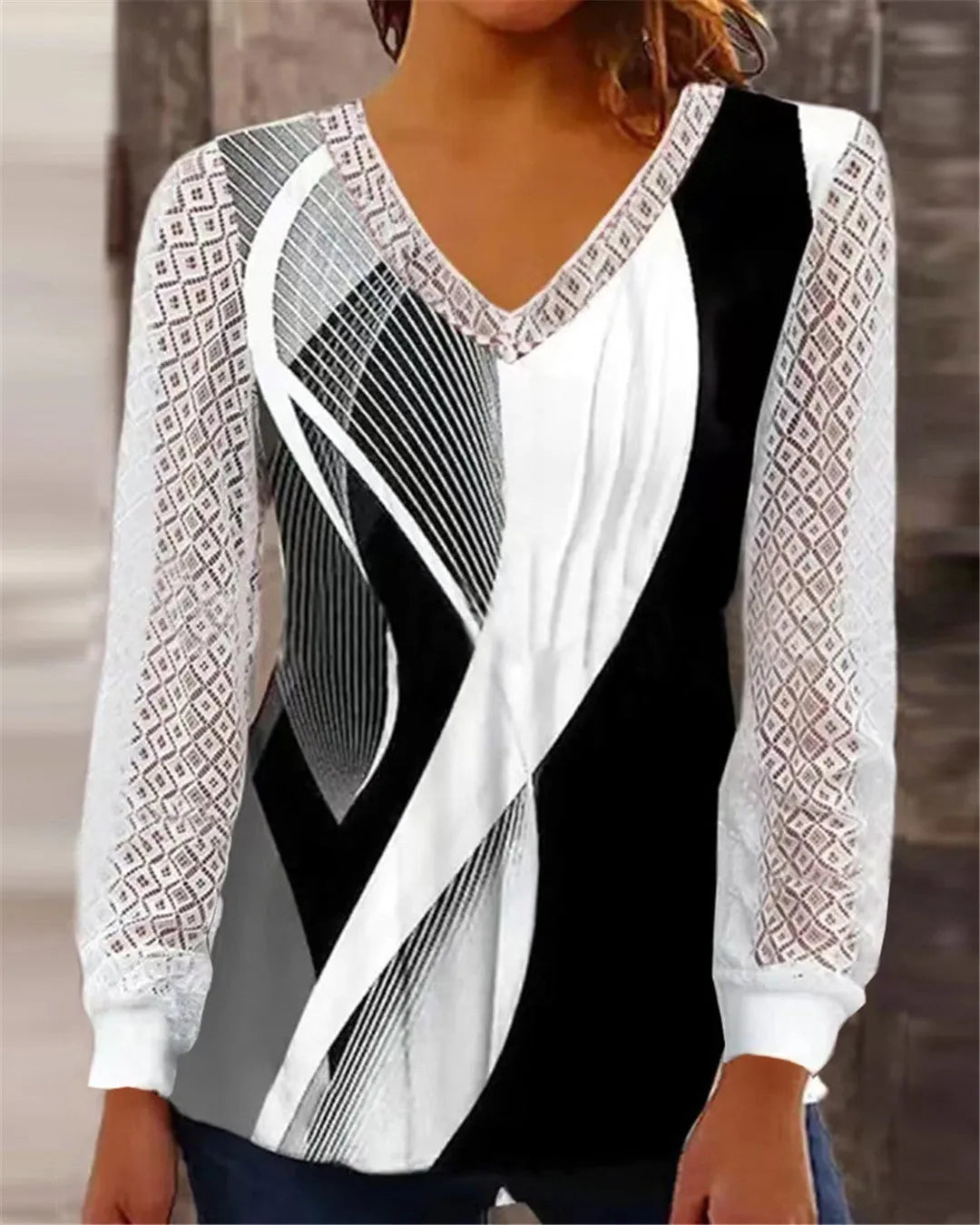 Loose V-neck women's top with hollow-out lace print design in polyester fabric