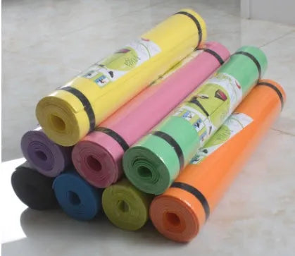 Red EVA fitness composite yoga mat with rolled edge showing 4mm thickness on a wooden floor.