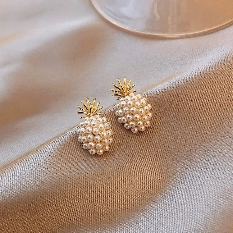 Women's gold Korean style alloy earrings with pineapple and starfish charms inlaid with artificial gems.