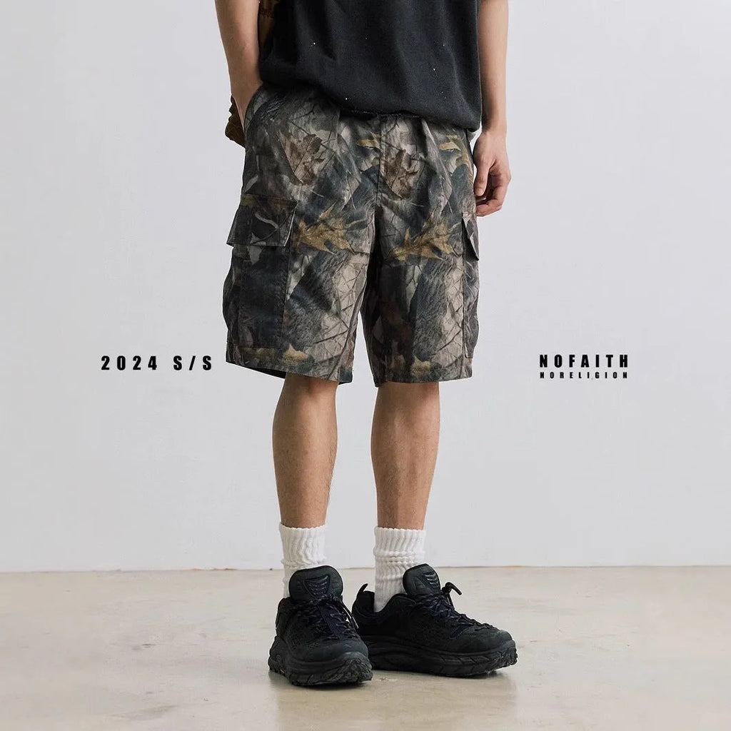 Loose casual straight-leg denim shorts in black on a hanger, showing mid waist and zip fly.