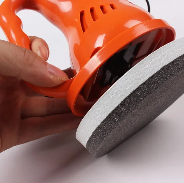 12V car polishing machine with ergonomic handle, thick cigarette lighter cord, black and orange colours