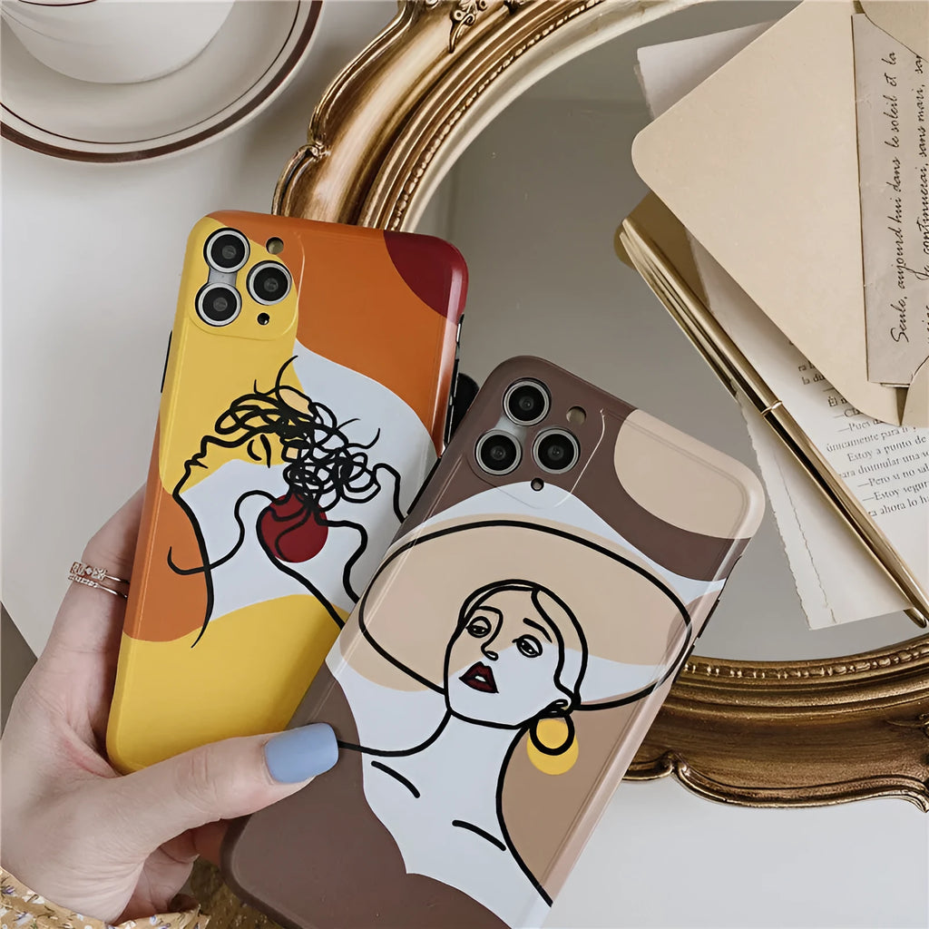 Orange yellow soft silicone iPhone case with cartoon line art graphic, shown fitted to an iPhone.
