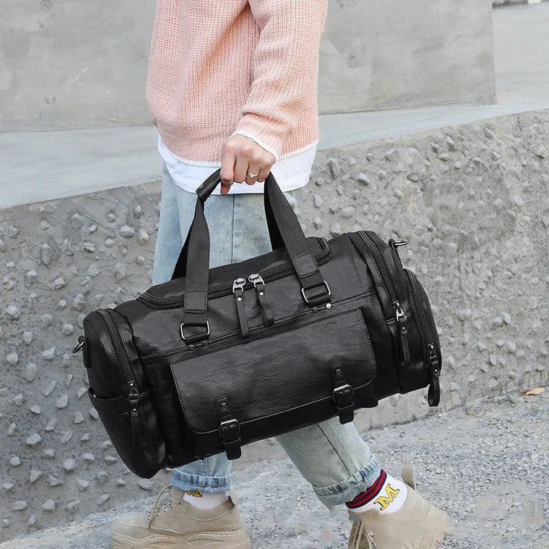Large black travel bag with a separate shoe compartment, showing PU fabric exterior.