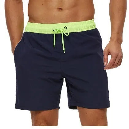 Men's blue fitness shorts with a stitching waistband, drawstring, and a side headband pocket.