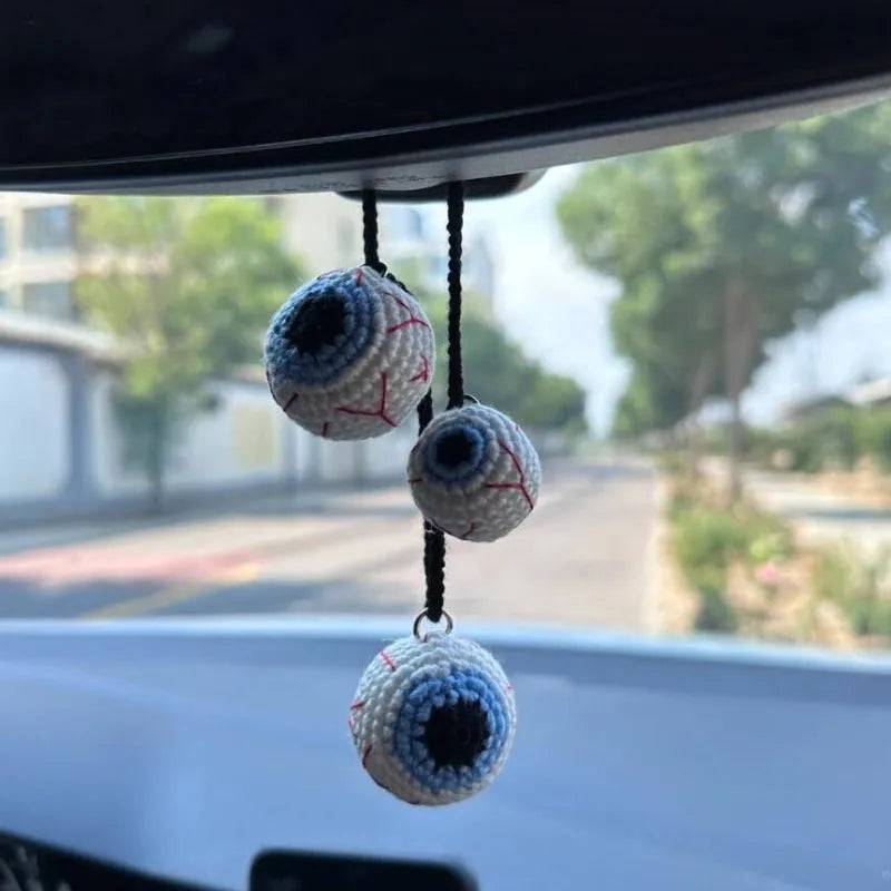 Plush hand-woven car hanging ornament in a cartoon design, made from soft polyester fabric.