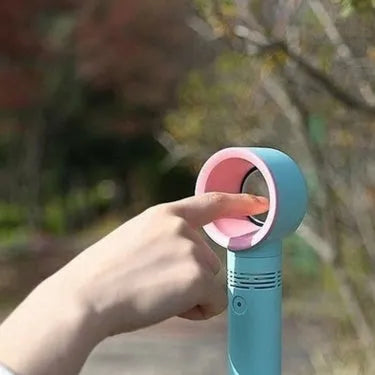 A compact USB rechargeable bladeless portable fan in various colours on its base.