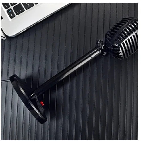 Black USB computer microphone on an adjustable desk stand with a weighted base.