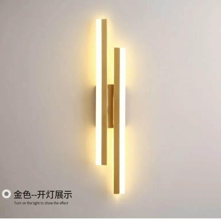 Minimalist Scandinavian-style LED wall light with acrylic shade in black or gold finish
