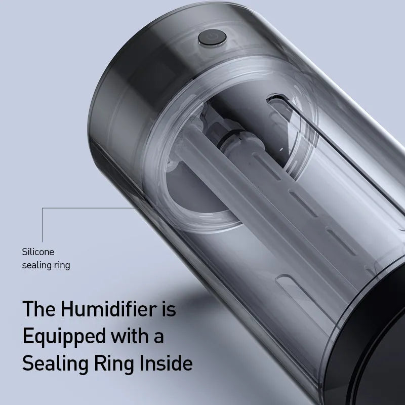 Black aluminium alloy car diffuser humidifier with USB cable, emitting cool mist for vehicle or desktop use.