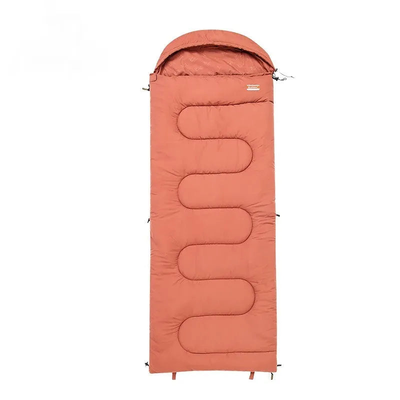 Outdoor cotton sleeping bag quilt shown in ochre and olive green colours, folded to show its ultra-light portable design.