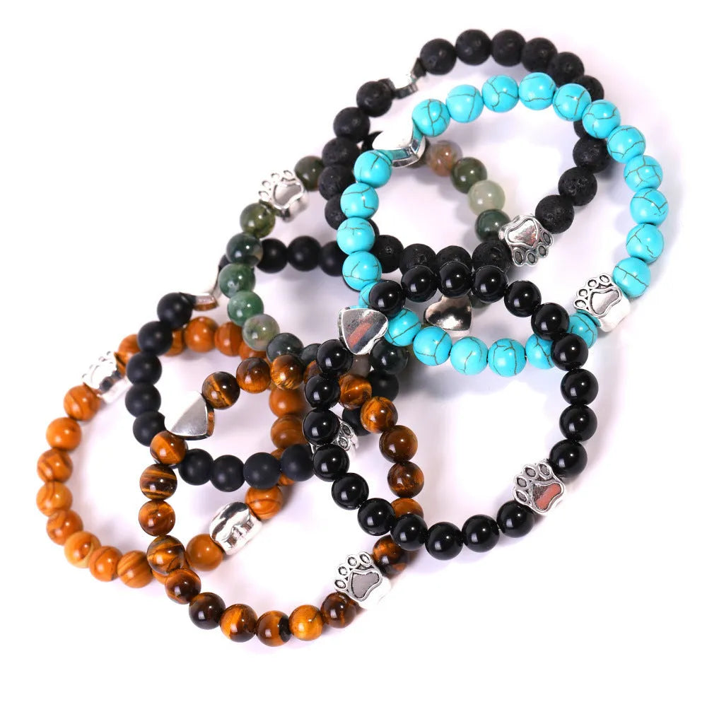Tiger's Eye stone beaded bracelet with a geometric dog's paw design on a wrist.