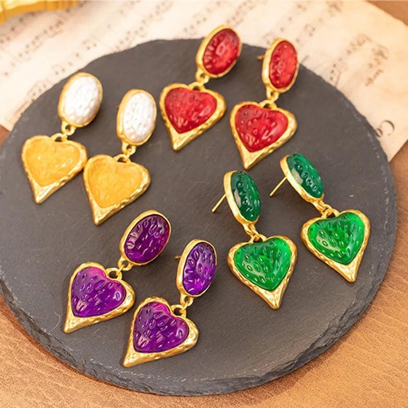 Silver pleated oval love heart stud earrings in purple, red, green, and yellow white colours.