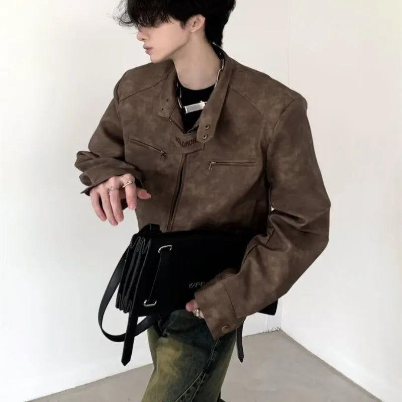 Men's retro brown PU leather short coat with long sleeves and tight fit, shown in casual style.