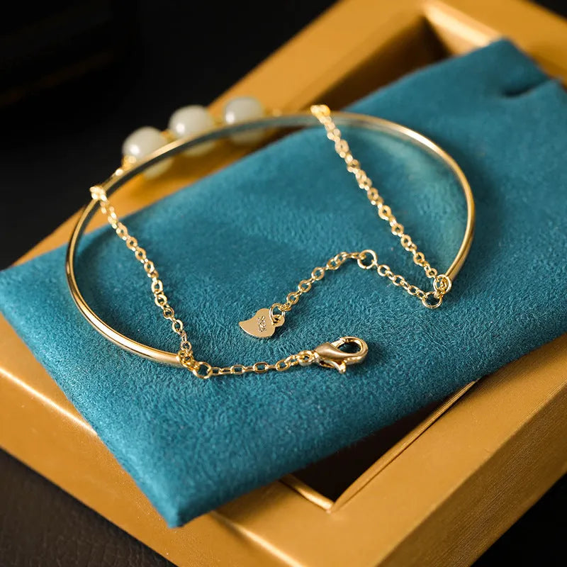 Hetian jade women's bracelet with gold inlay, shown in single, double, and three bead versions.