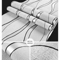 Close-up of light grey 3D stripe wallpaper with thick deerskin velvet texture on a non-woven base.