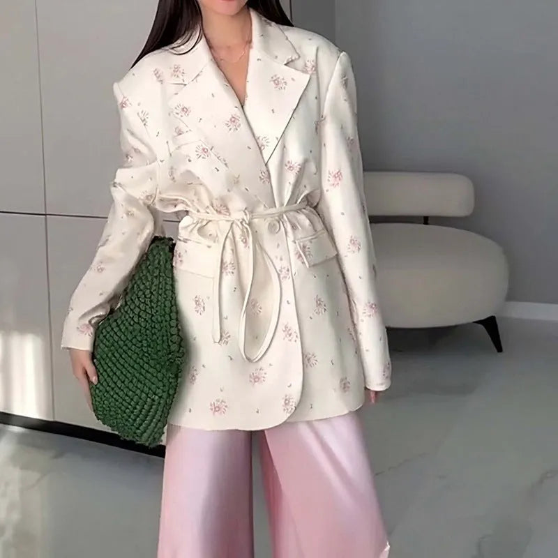 Women's white suit jacket with a lace-up detail on the collar and an adjustable waist tie, shown in a regular fit with long sleeves.