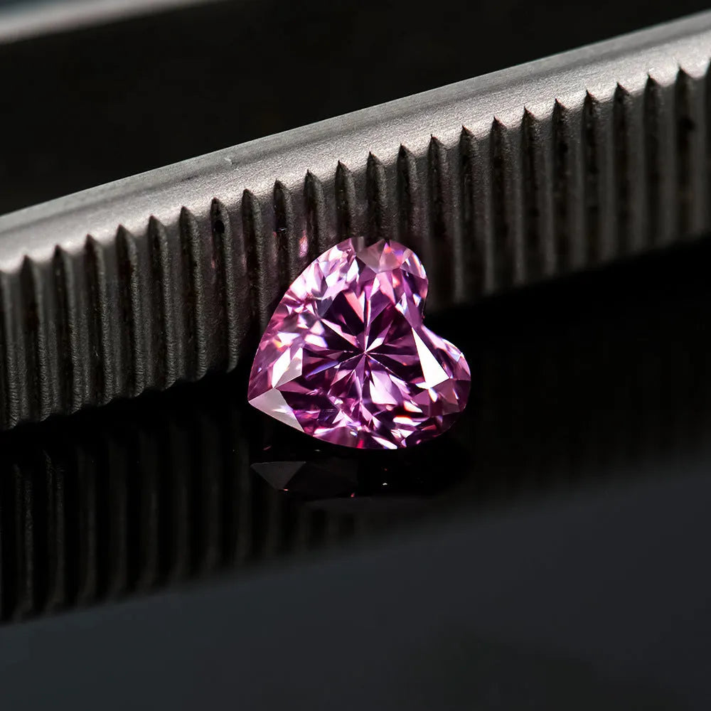 Heart-shaped moissanite gemstone in lemon yellow colour, shown alongside other colour options.