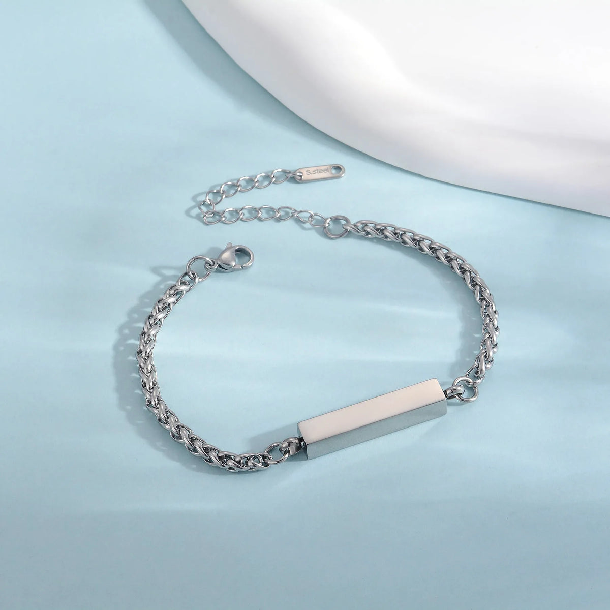 Unisex titanium steel rectangular column bracelet in silver, gold or black, 6mm x 30mm centre with 18cm band and 5cm tail chain.