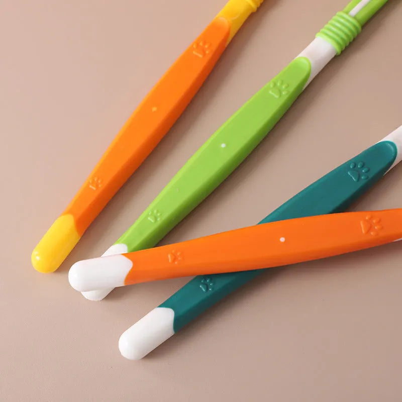 Six coloured pet toothbrushes with plastic handles and nylon bristles for dog and cat dental care