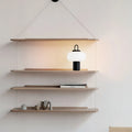 Minimalist Japanese glass table lamp on a bedside table, dimensions 230mm by 330mm.
