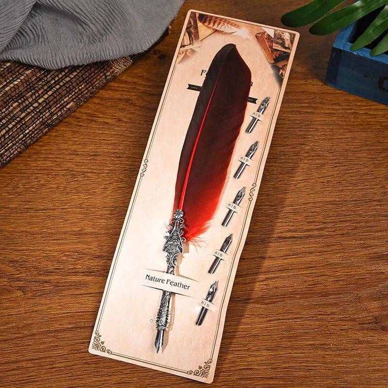 Vintage feather dip pen with zinc alloy holder in assorted colours on a wooden desk