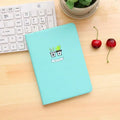 Leather handbook notebook 36K with 112 beige pages closed, showing blue red and white colour options
