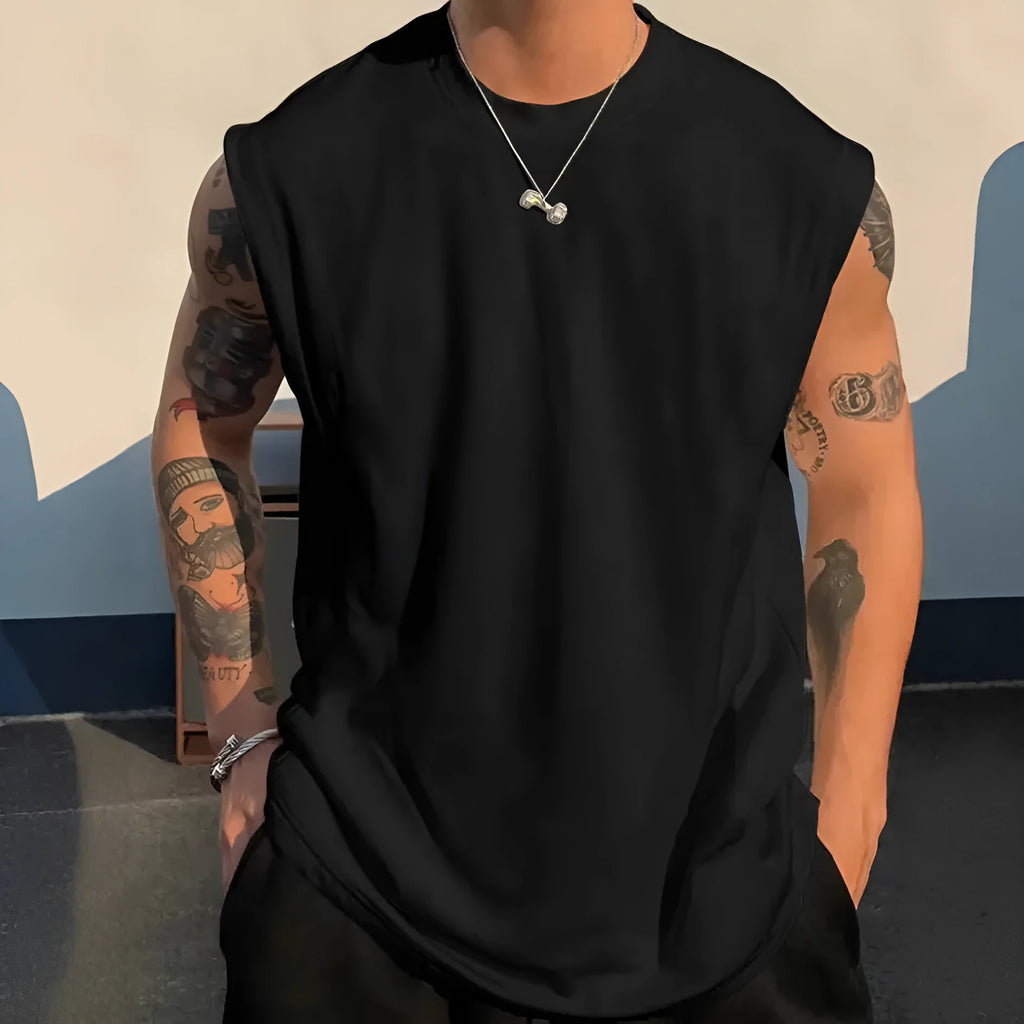 Men's loose sleeveless cotton t-shirt in a solid colour on a hanger.