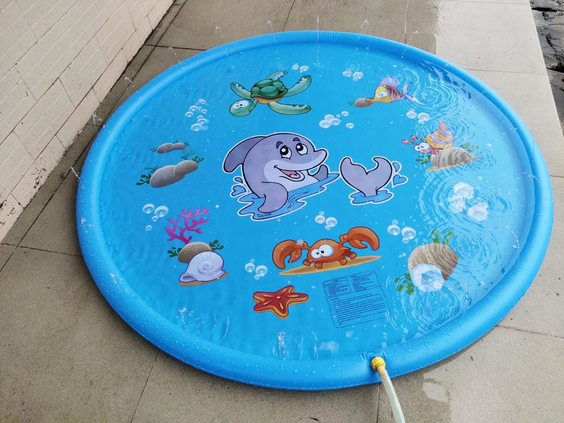 Blue PVC children's water spray play mat with marine animal graphics, measuring 100cm by 170cm