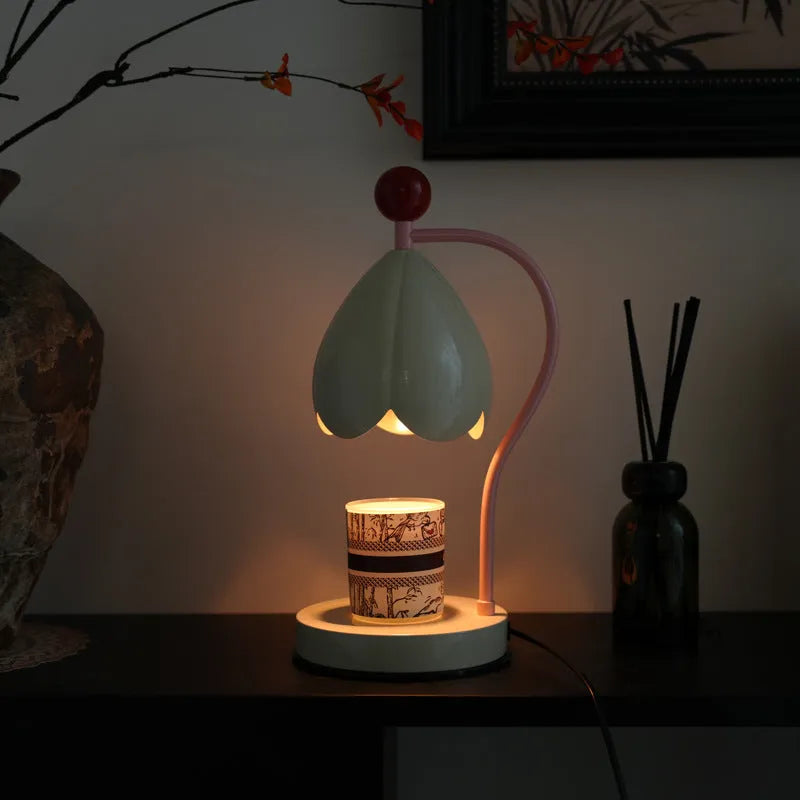 Linglan ancient style cream white melting wax fragrance lamp with metal holder on a desk