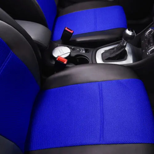 Black synthetic leather car seat cover installed on a front car seat, showing stitched design.