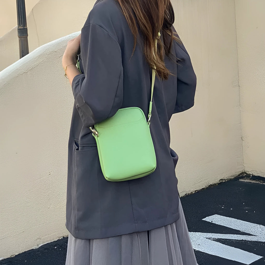 Solid colour women's PU crossbody phone bag shown in beige, displaying front view.