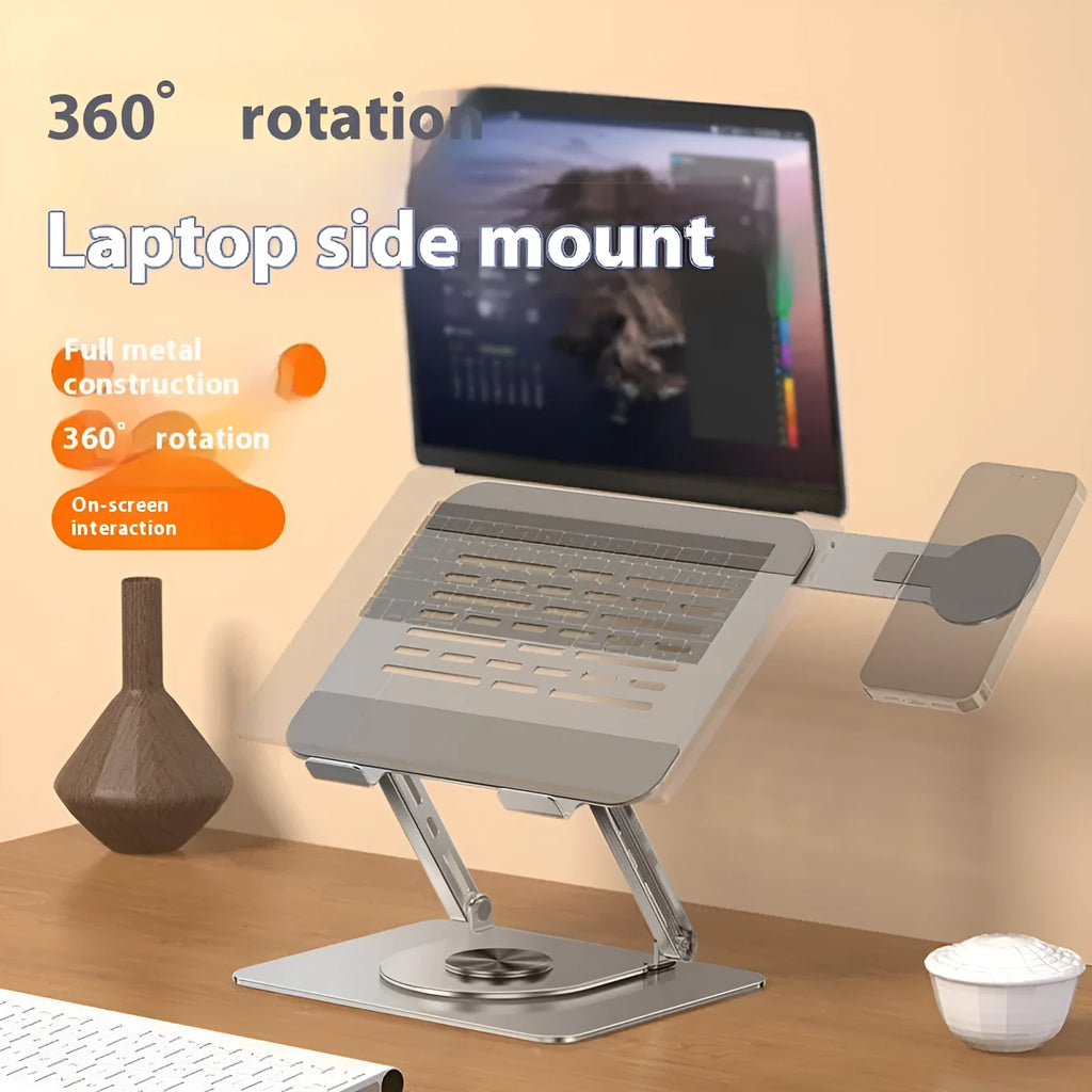 Silver carbon steel laptop stand with rotating magnetic phone holder mounted beside 17-inch laptop