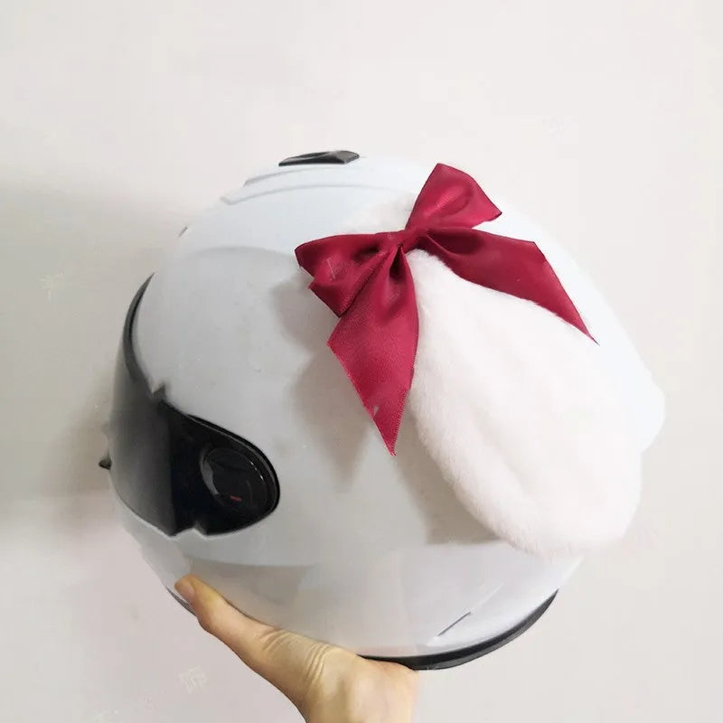 Carbon fibre rabbit ears motorcycle helmet decoration in multiple colours on a black helmet.