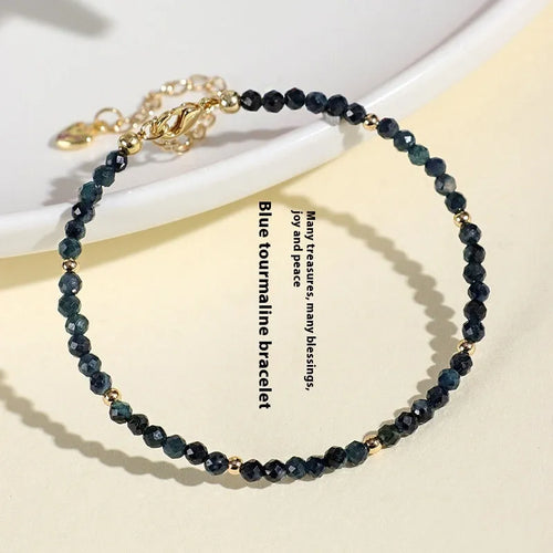 Blue tourmaline beaded bracelet with 3mm stones and spacer bead sections