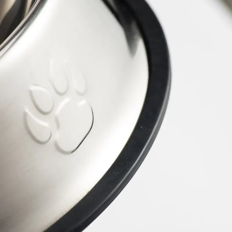 Stainless steel dog bowl with footprint pattern, available in sizes from 15cm to 34cm diameter