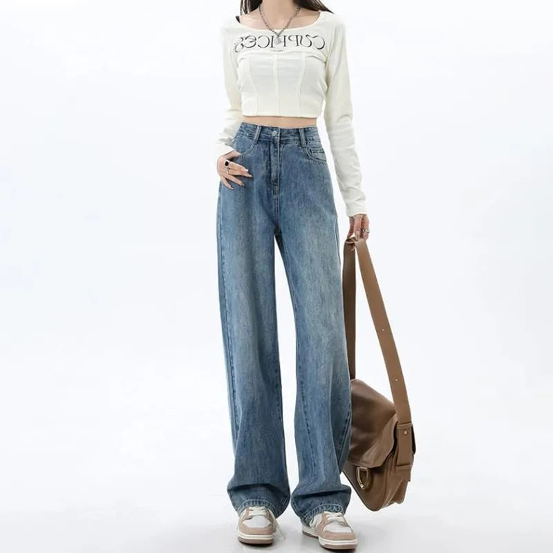 Women's retro blue high-waist wide-leg denim trousers on a hanger, showing straight leg cut.