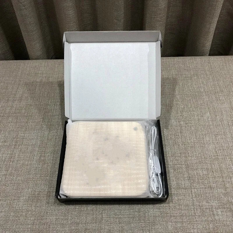 Square pine wood USB LED lamp emitting warm white 3D pattern light on a dark surface.