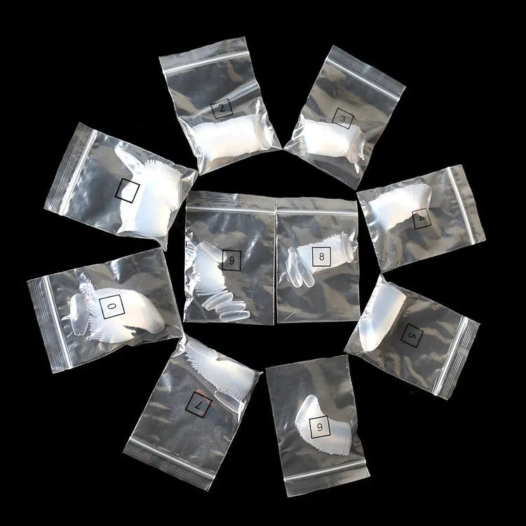500 clear natural acrylic false nails in various sizes on a white background.