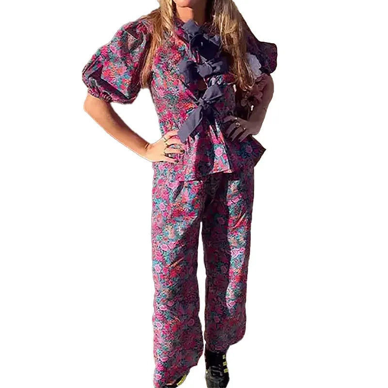 Women's floral print tie-neck long sleeve top with puff sleeves and matching trousers suit set