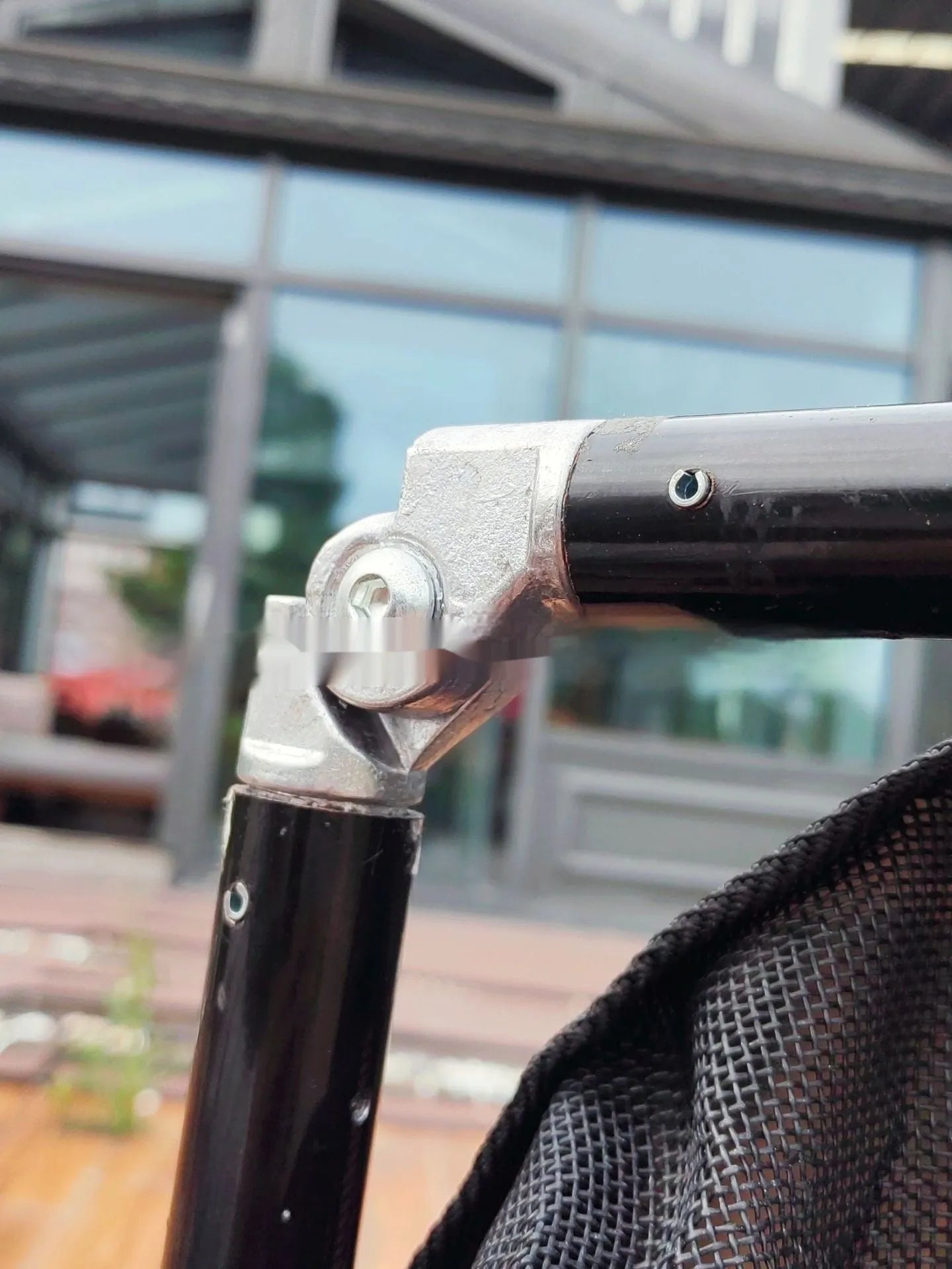 Large black aluminium alloy folding stretcher for dog emergency transport.