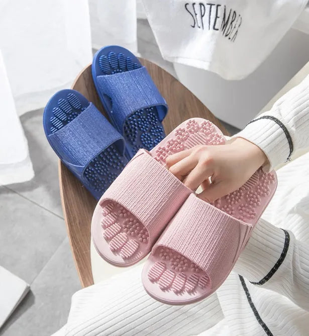 Reflexology acupressure slippers in EVA material with 3D massage particles, available in blue, grey, light blue, pink, purple