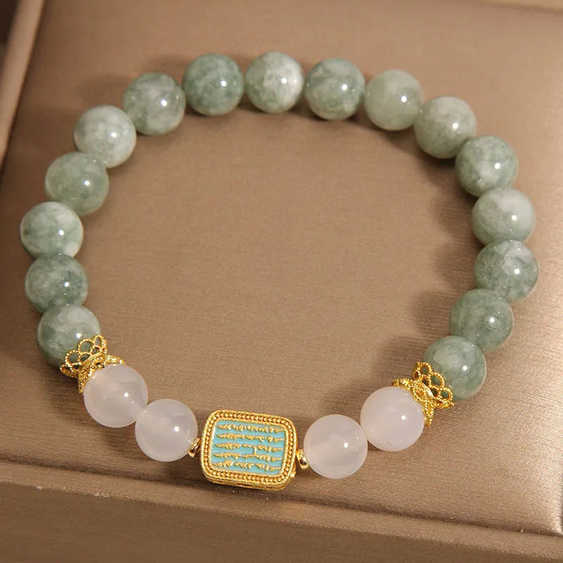 Women's oil green emerald crystal bracelet showing five engraved scripture sections