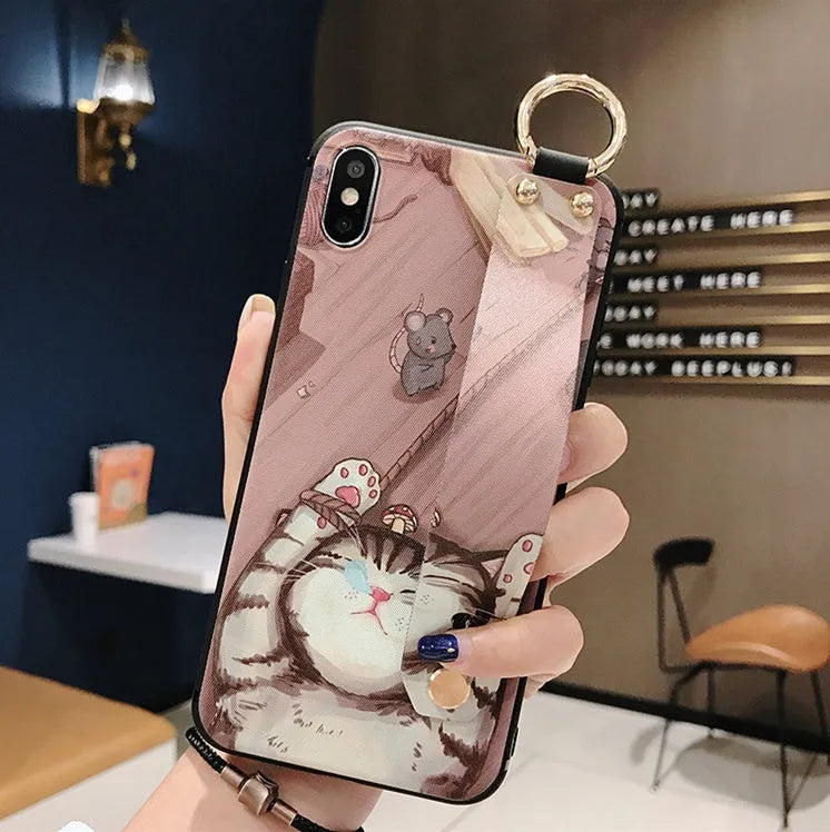 Rose flower design wrist strap case for iPhone on a table