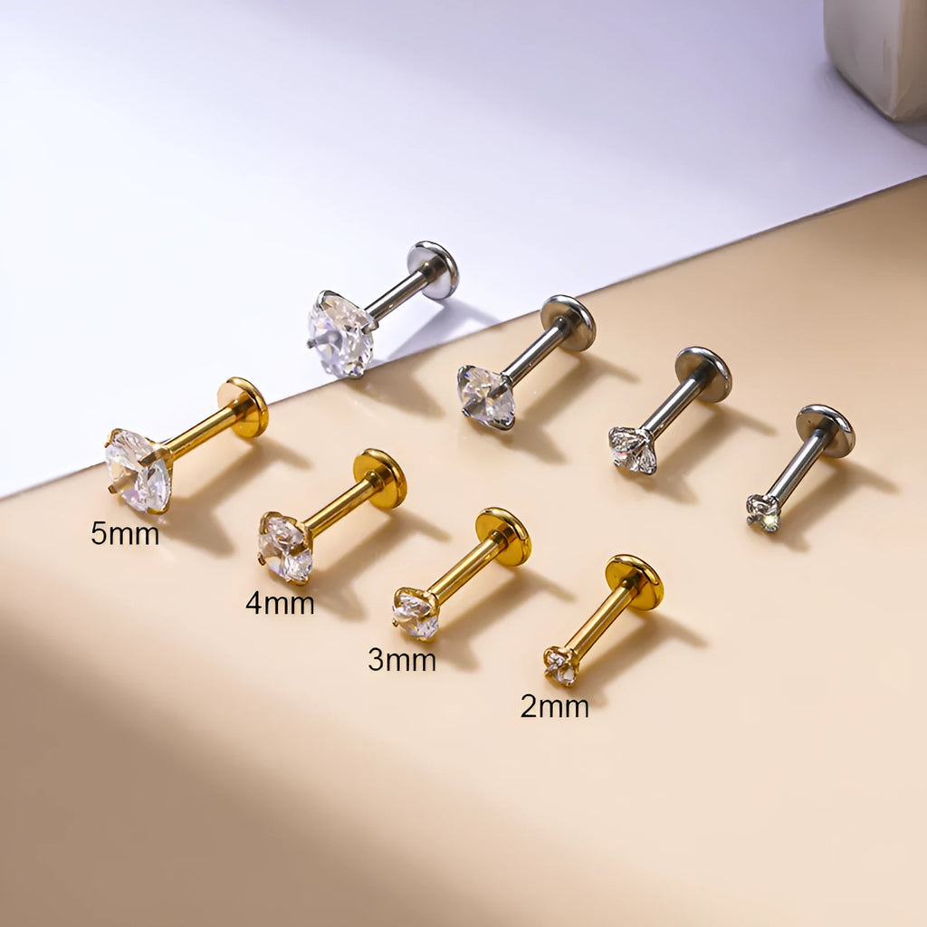 Stainless steel inner rod ear bone stud with geometric shape and electroplated finish on silver background